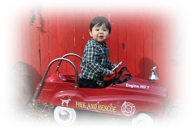 Neighbors boy on firetruck